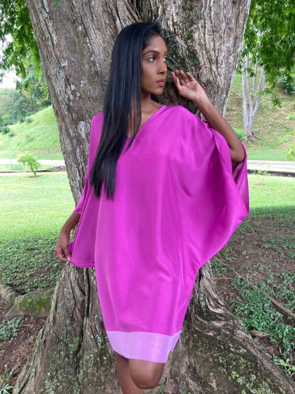 Dare to be different in this luscious one-of-a-kind modified kaftan with billowing sleeves