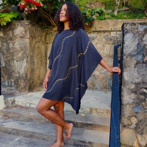 Our little black dress is embellished with a hand painted gold swirling motif that spills over the shoulder to the back of the dress. It's perfect for a night out or something a little dressier. Pair with some gold sandals to complete the look.